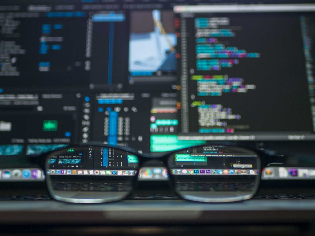 data-codes-through-eyeglasses-577585 Eyeglasses reflecting computer code on a monitor, ideal for technology and programming themes.